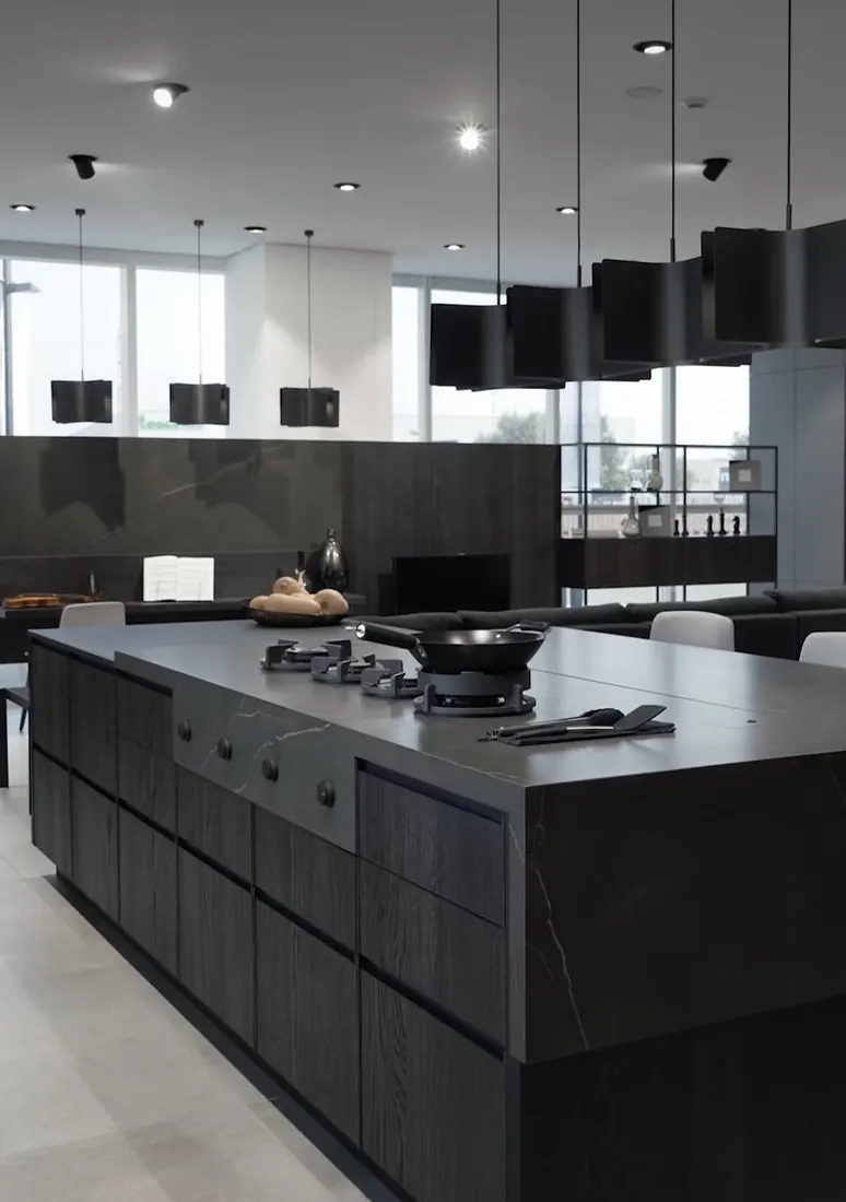 Modern kitchen with a dark natural stone island and backsplash