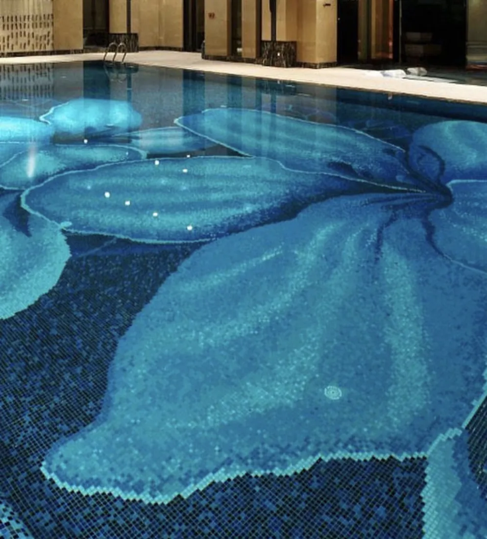 Swimming pool with a blue glass mosaic floral design