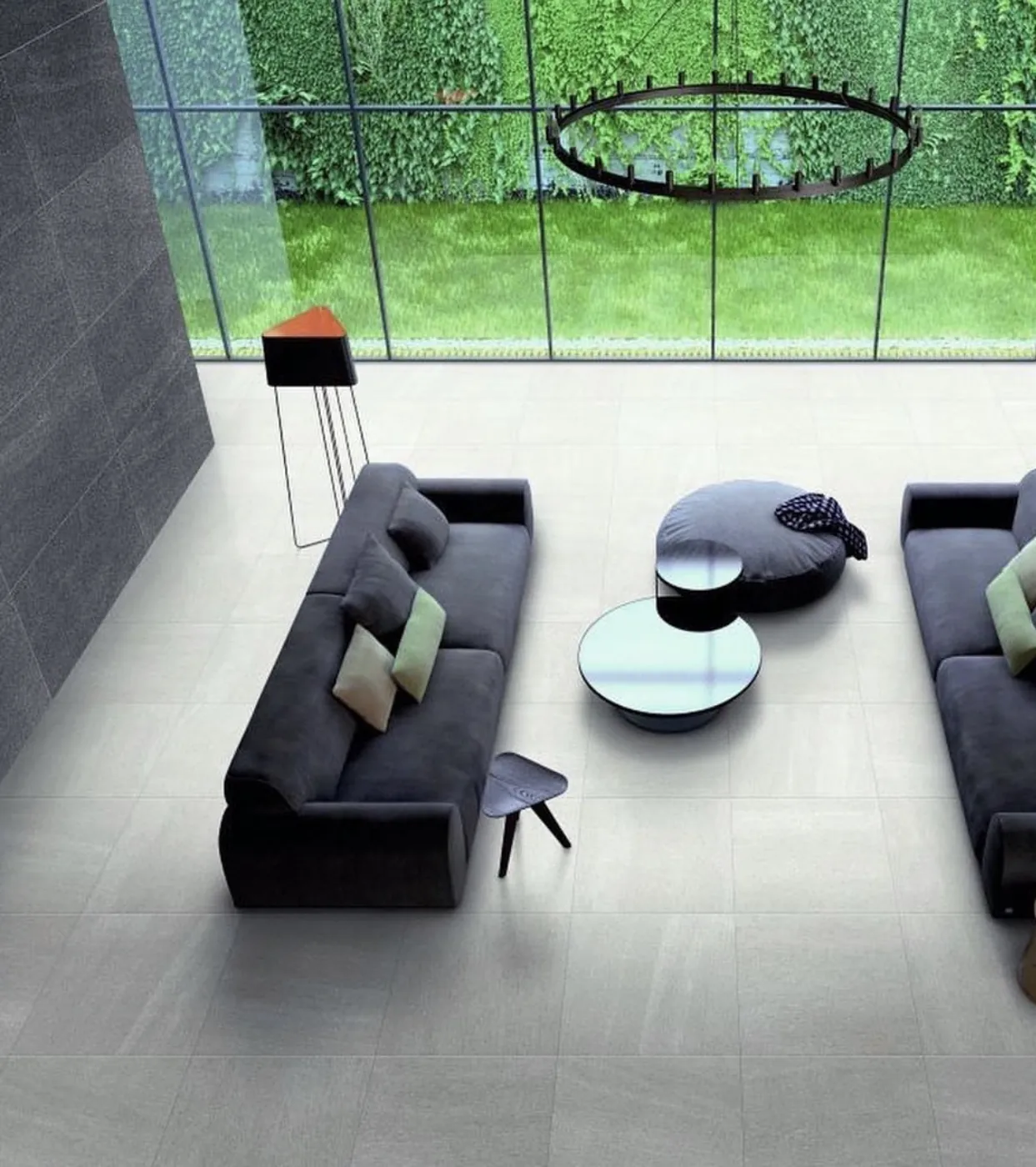 Luxury living space with large-format tile flooring and a natural stone feature wall