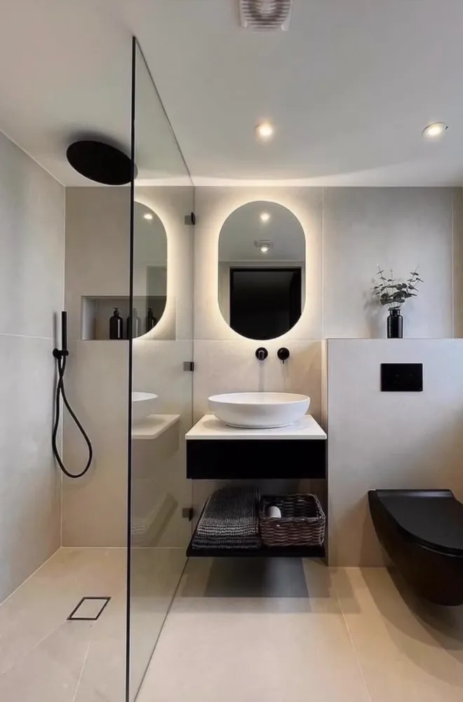 Modern residential bathroom with large-format tile, walk-in shower, and floating vanity